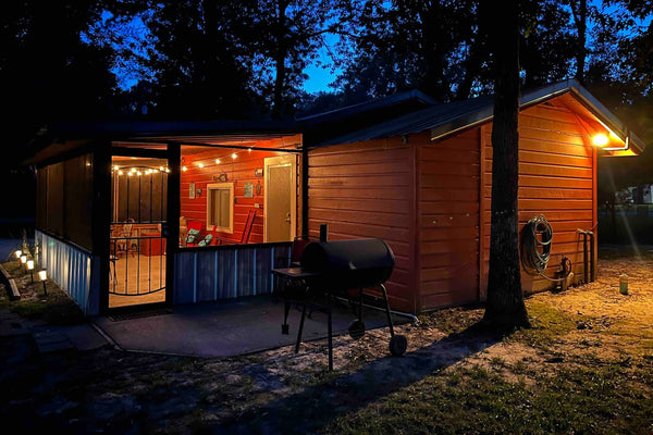 Fishing cabin near Lake Sam Rayburn at dusk with smoker grill